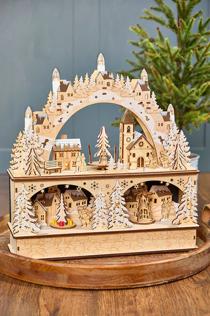 14.75' Lighted Laser Cut Wood Village Scene with Moving Figurine and  Candles - Decorator's Warehouse