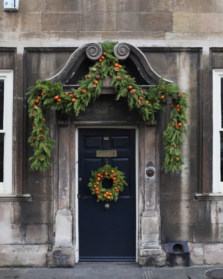 15 Christmas Door Decoration Ideas (With Inspiring Photos) | Apartment  Therapy