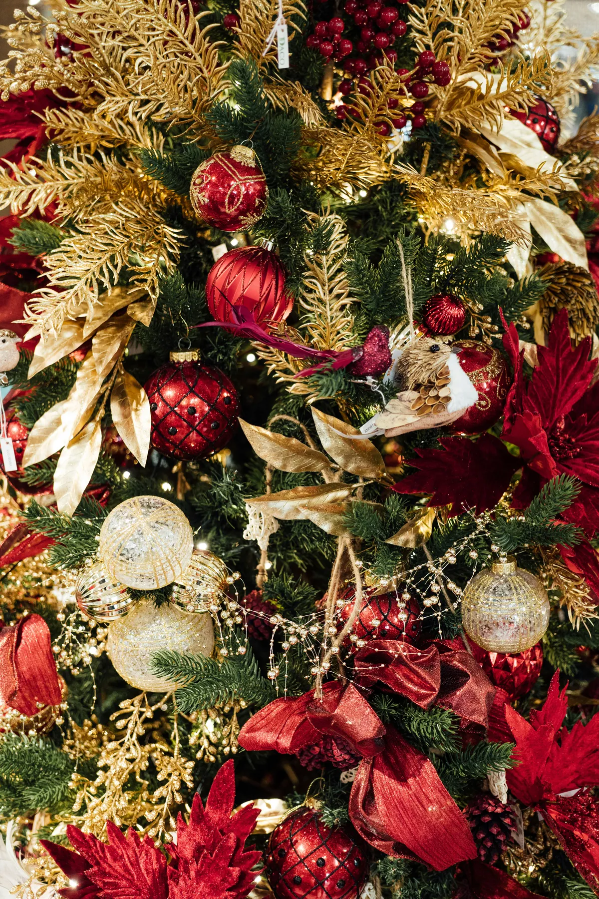 a christmas tree with red and gold decorations