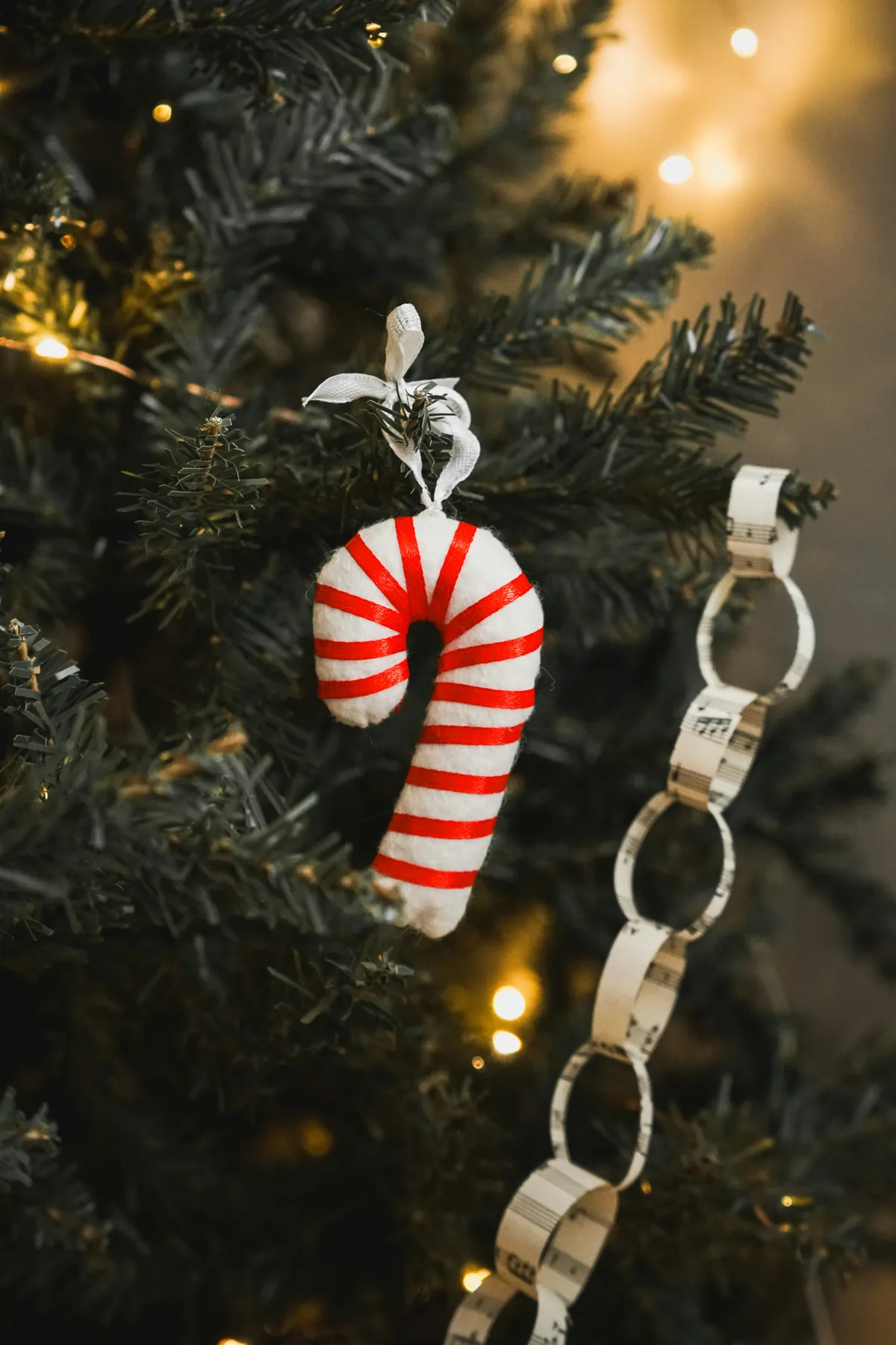 a close-up view of a beautifully decorated Christmas tree featuring handmade crochet and felt ornaments