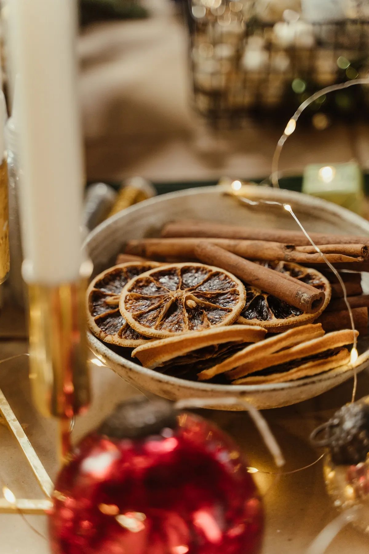 A cozy arrangement of dried oranges and cinnamon sticks, perfect for festive decor.