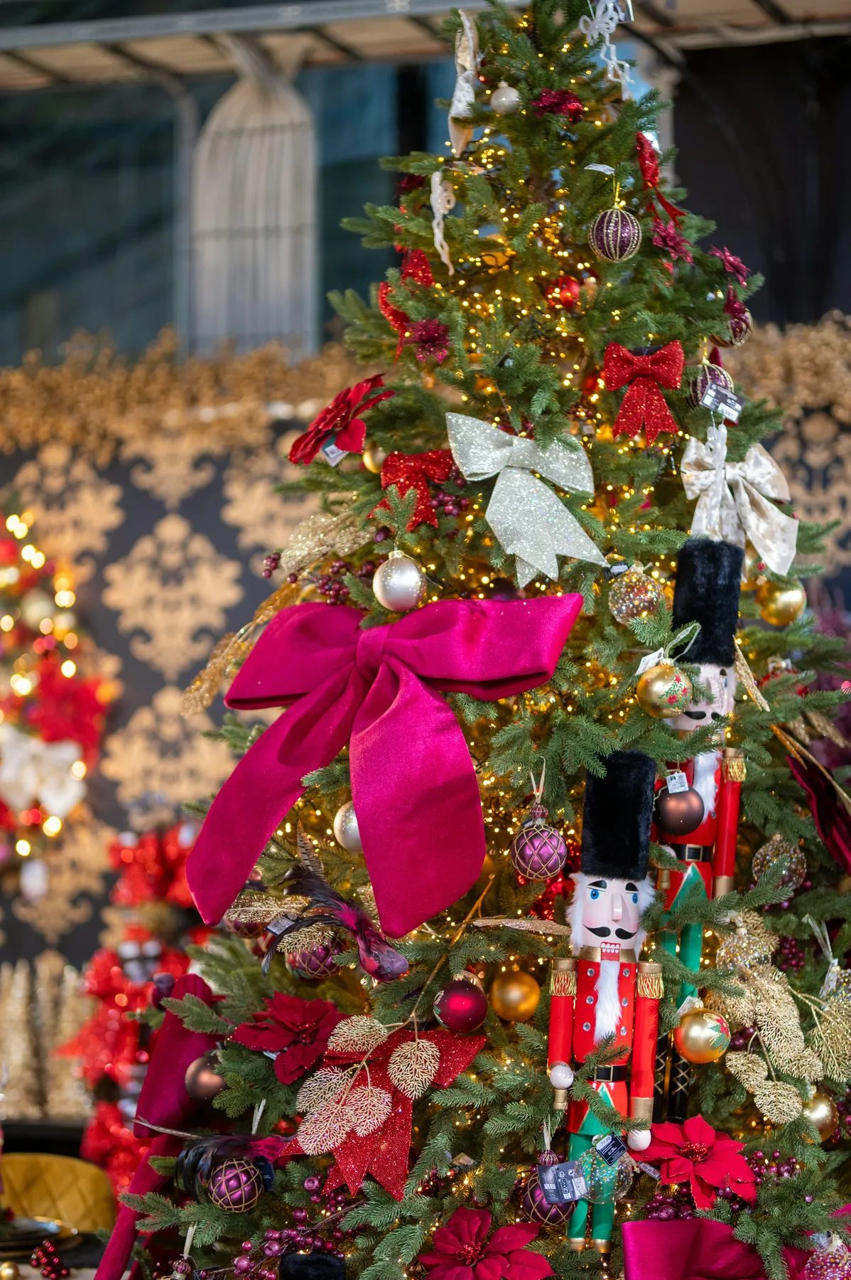 A decorated christmas tree with nutcrackers and bows