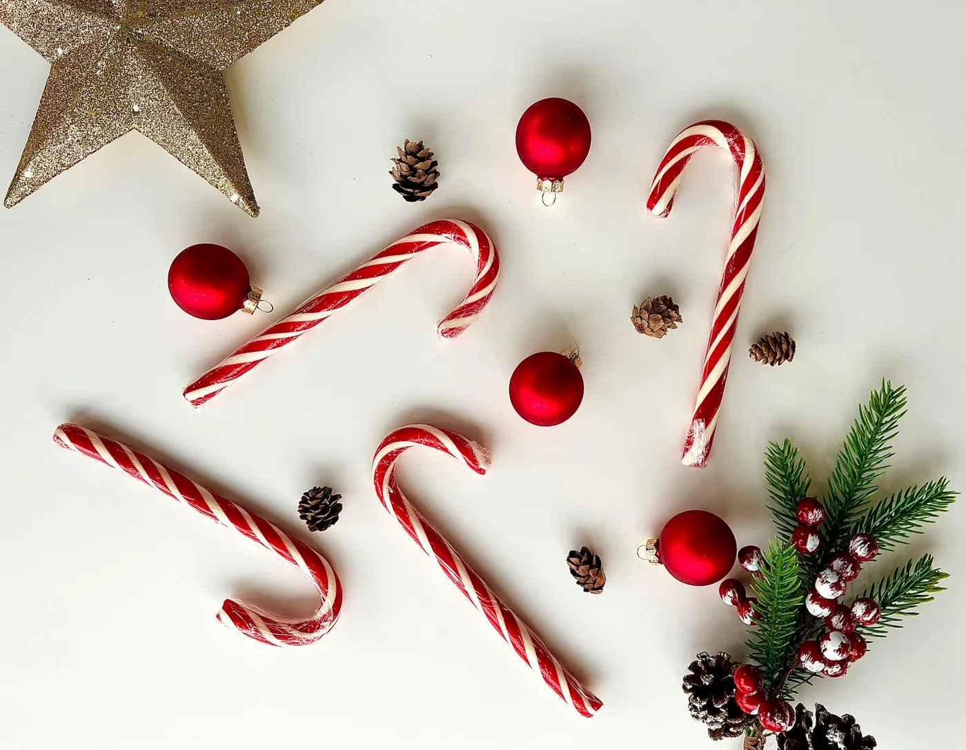 a white table topped with candy canes and christmas decorations