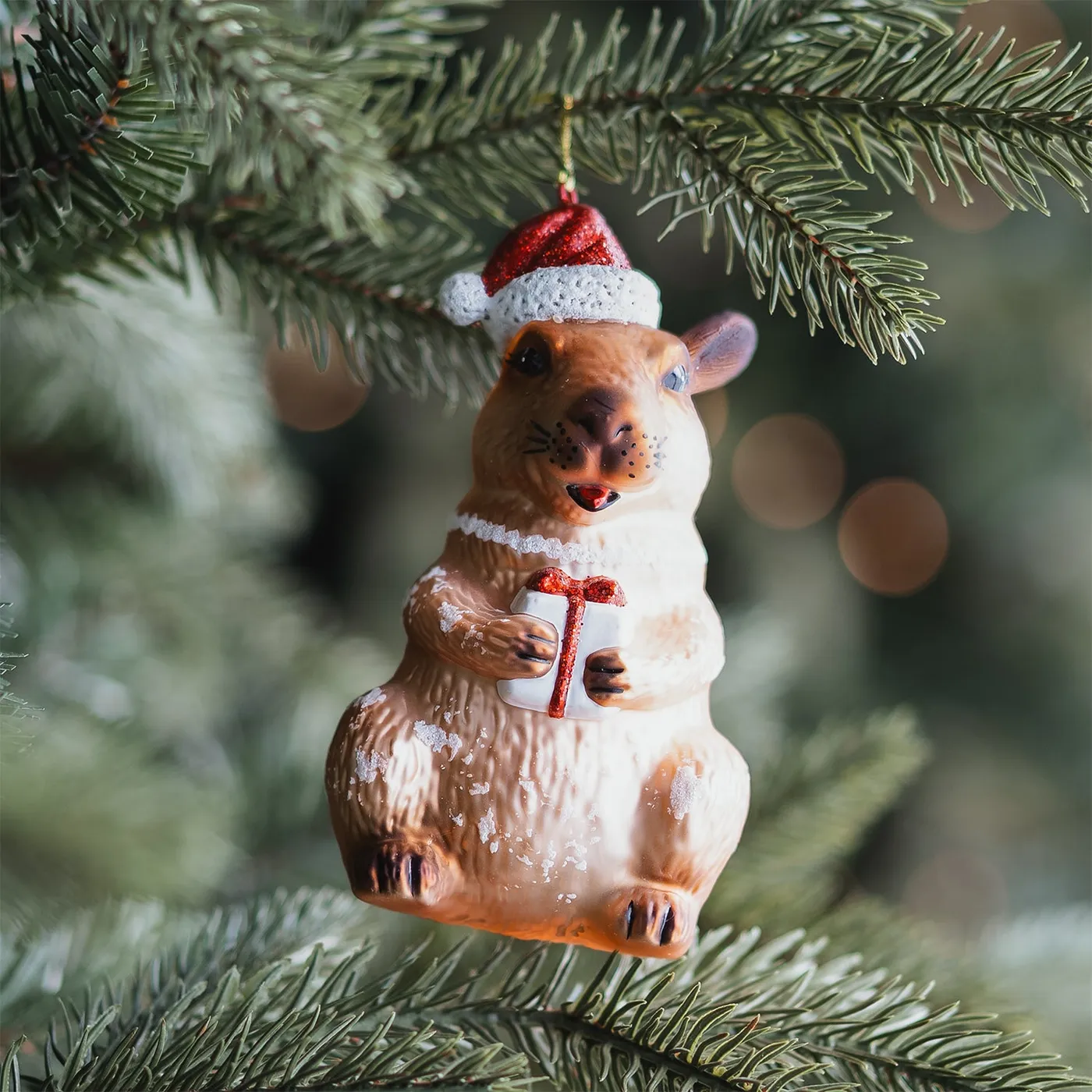Capybara Christmas ornament with red glitter hat
