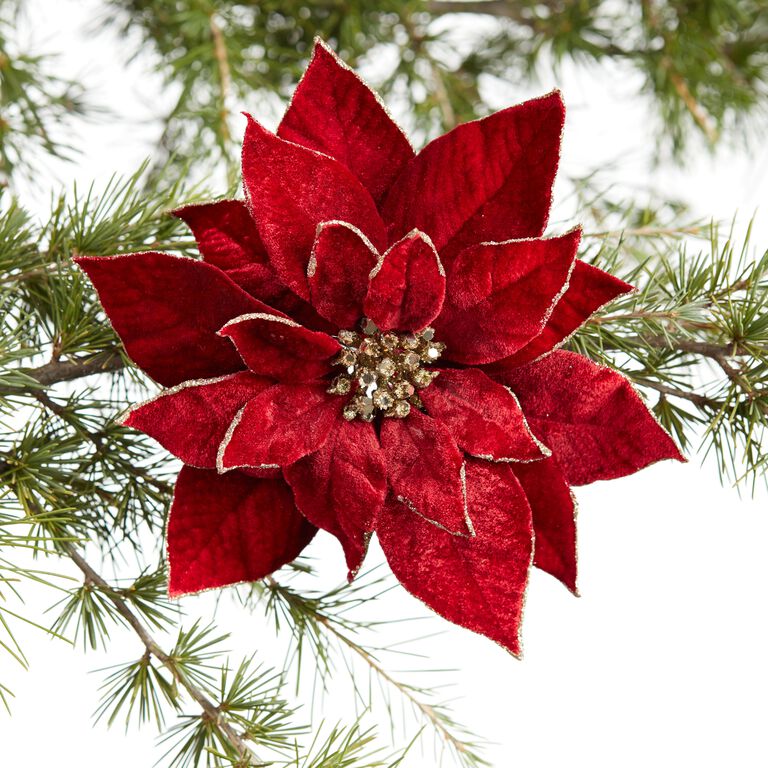 Christmas Tree Ornament Poinsettia A Christmas Tree Decorated With Red  Poinsettia Plants And Silver Ornaments Stock
