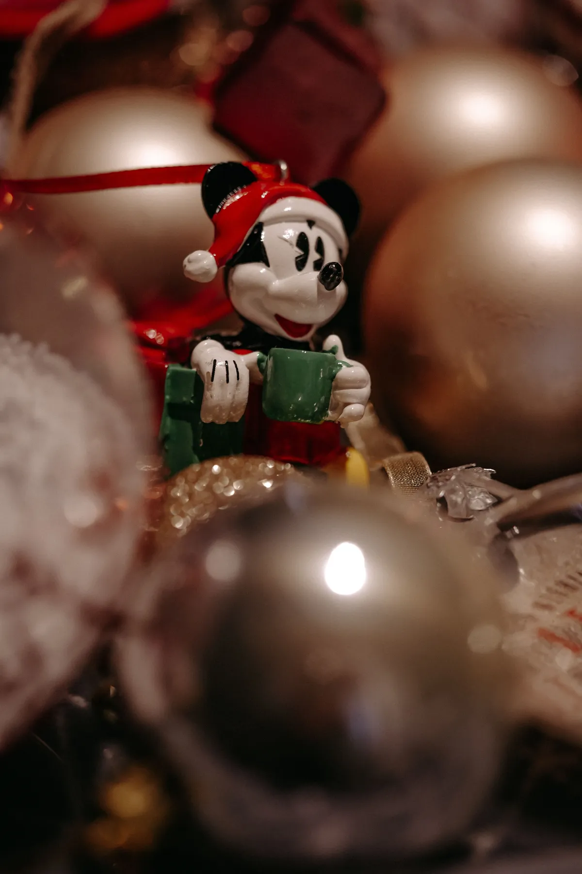 Close-up of a vintage Christmas ornament featuring a beloved character in a festive setting.