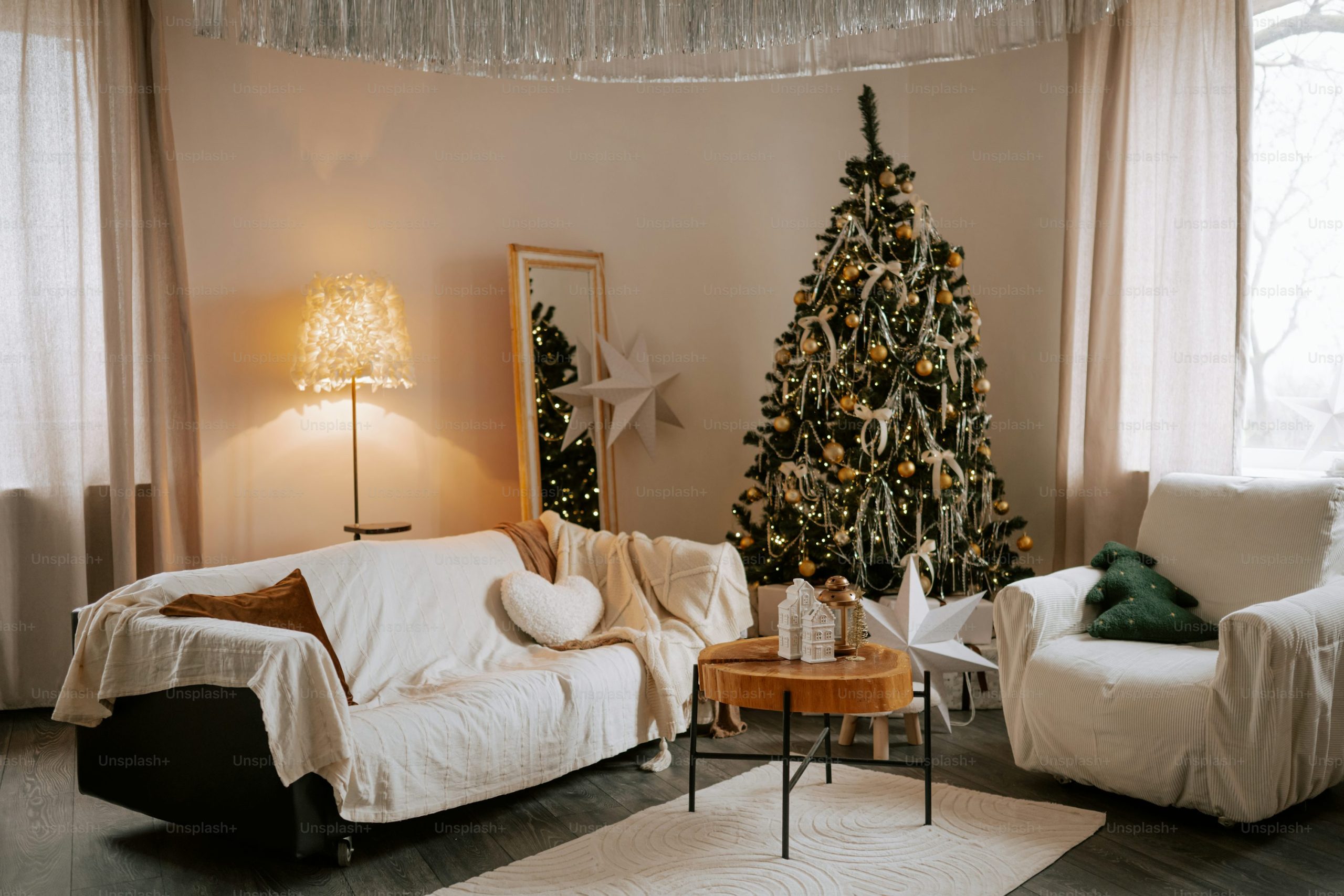 Cozy living room with christmas tree and gifts - Photo on Unsplash+