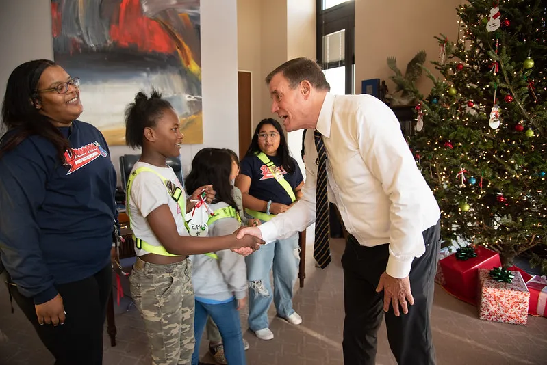 Dumfries Elementary School children hang Christmas decorations at Sen. Mark  Warner's office