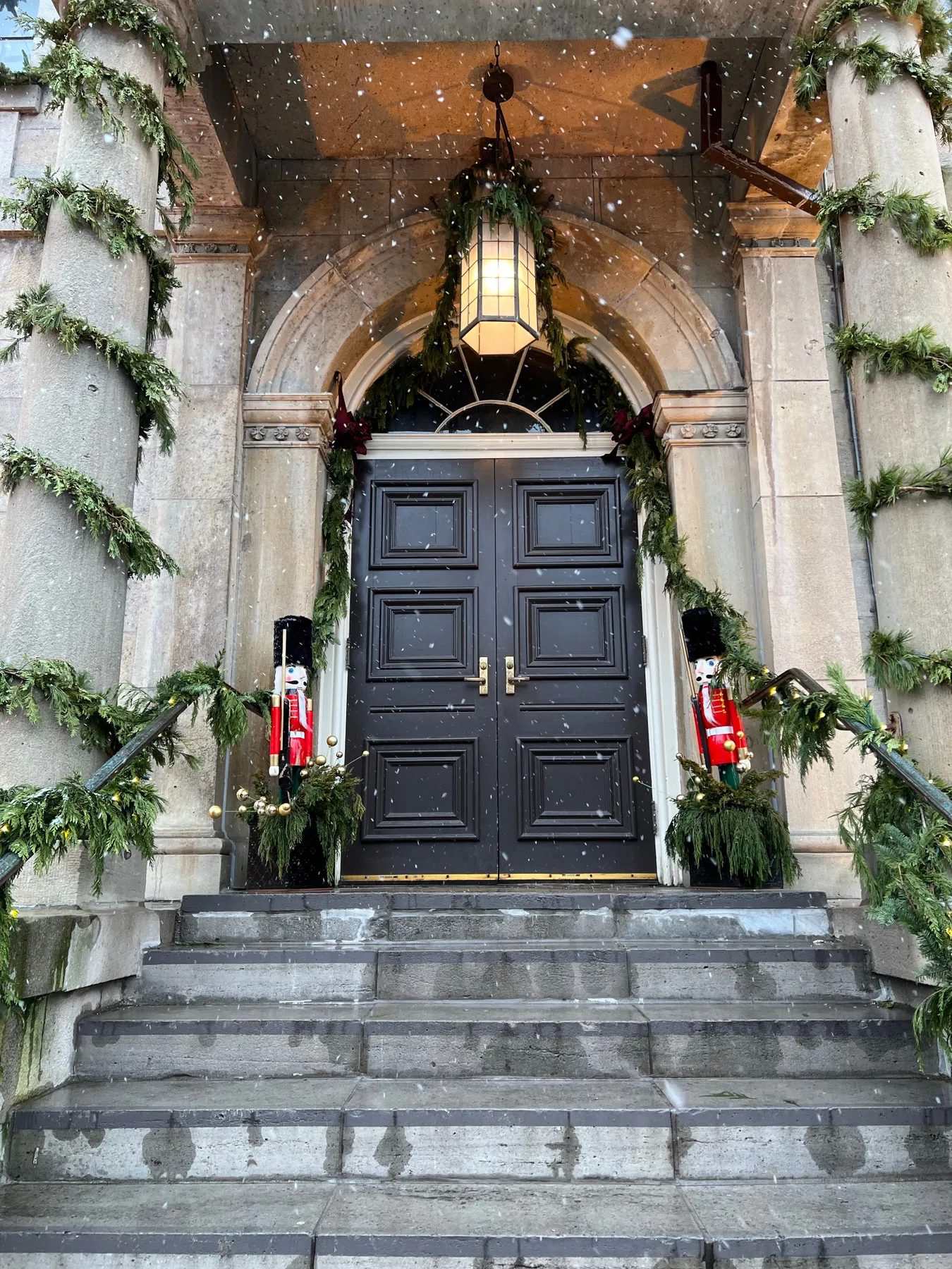 Elegant door adorned with holiday greenery and nutcrackers in Niagara-on-the-Lake.