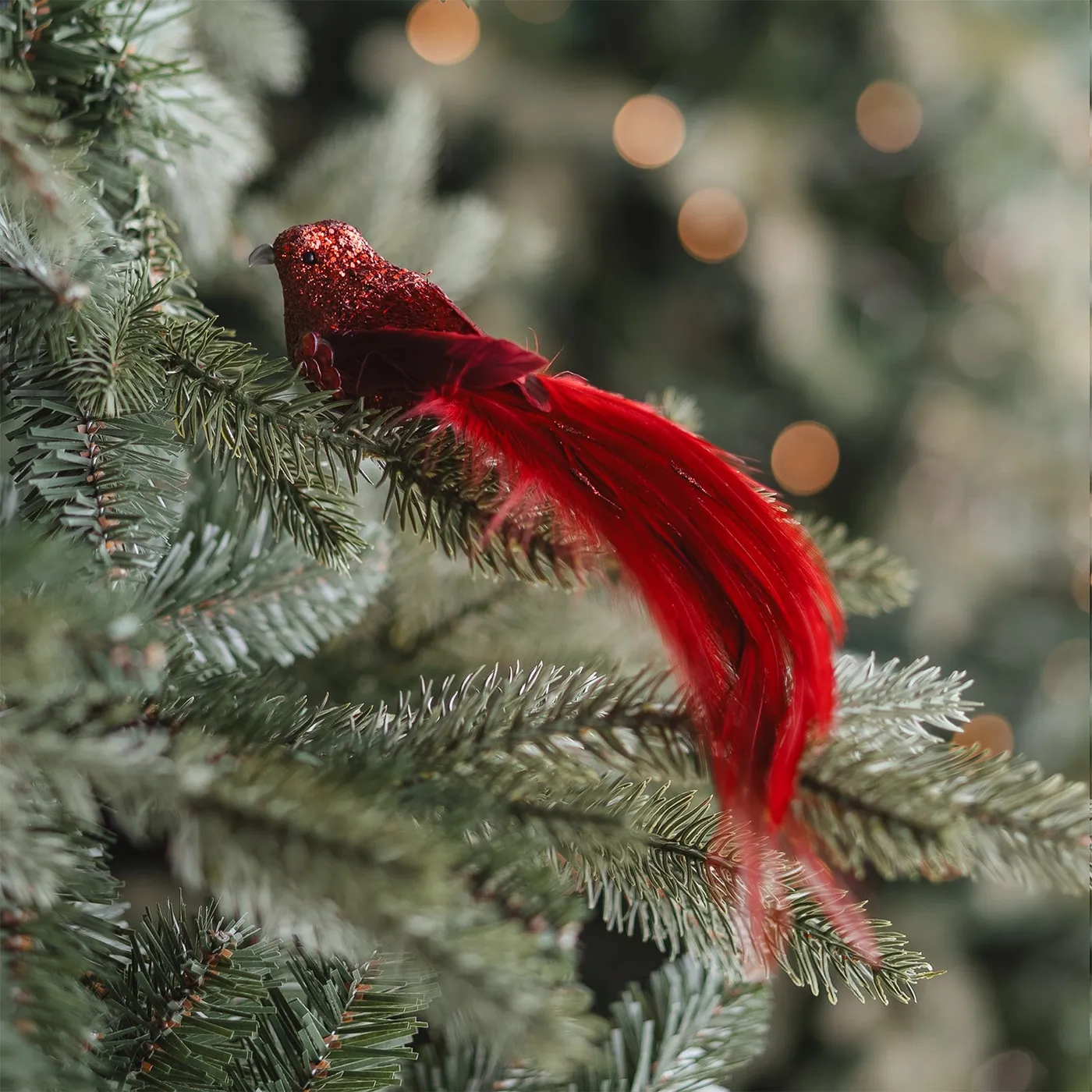 Large red clip-on bird with long glitter tail