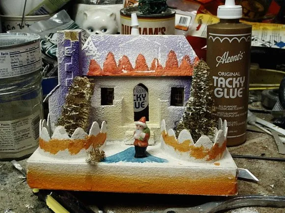 Restoring miniature trees on old Christmas village putz houses.