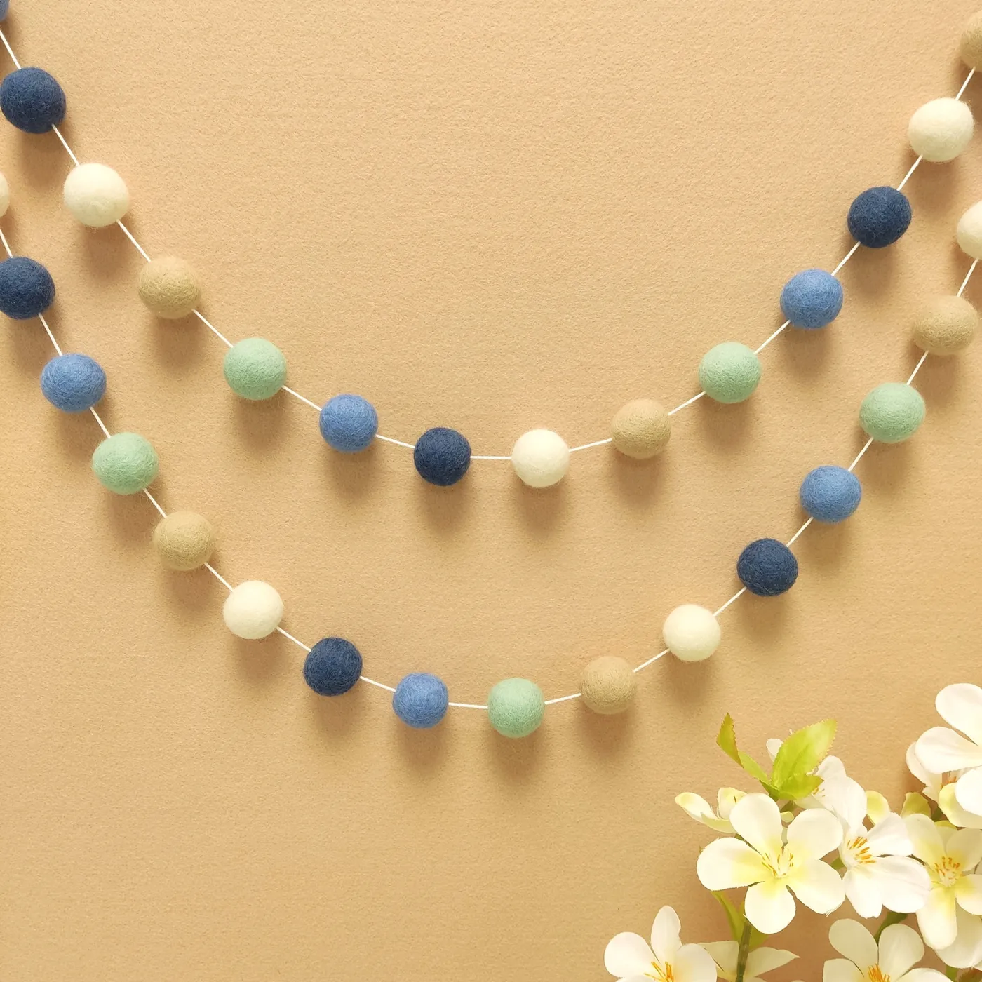 Riviera felt ball garland Mediterranean blue baby room | CELAINEDECO