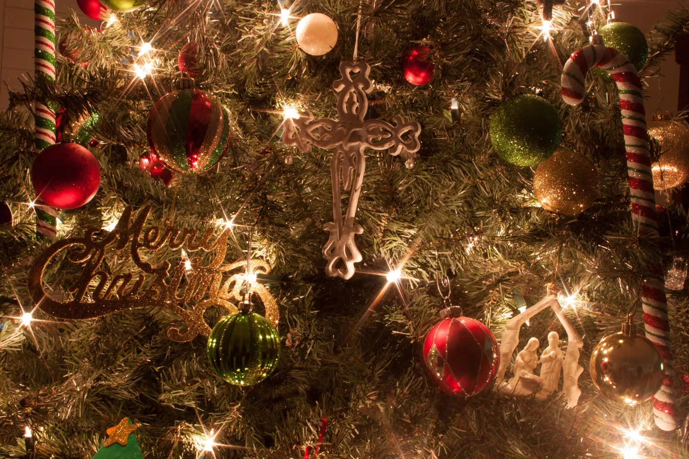 Royalty-Free photo: Closeup photo of brown Christmas tree with lights and  baubles | PickPik
