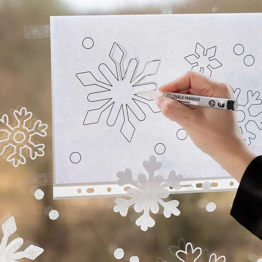 Snowflake window decoration with chalk markers