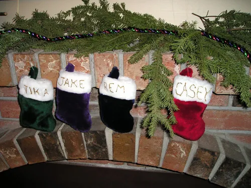 The hanging of stockings by the fireplace mantle has been an essential part  of the Christmas tradition for centuries | The Vintage News
